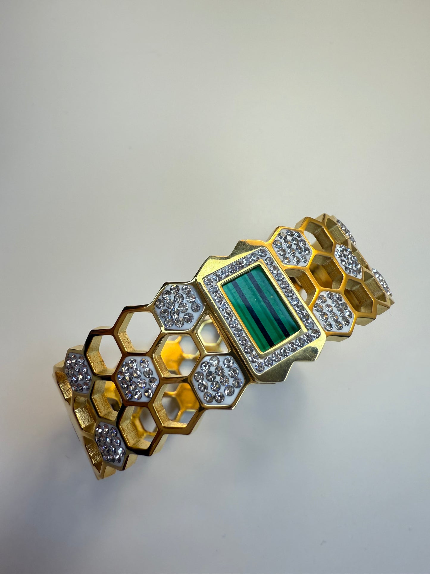 Elegant golden bangle with greenstone