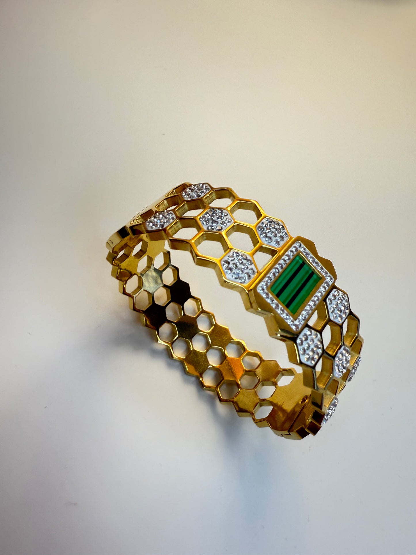Elegant golden bangle with greenstone